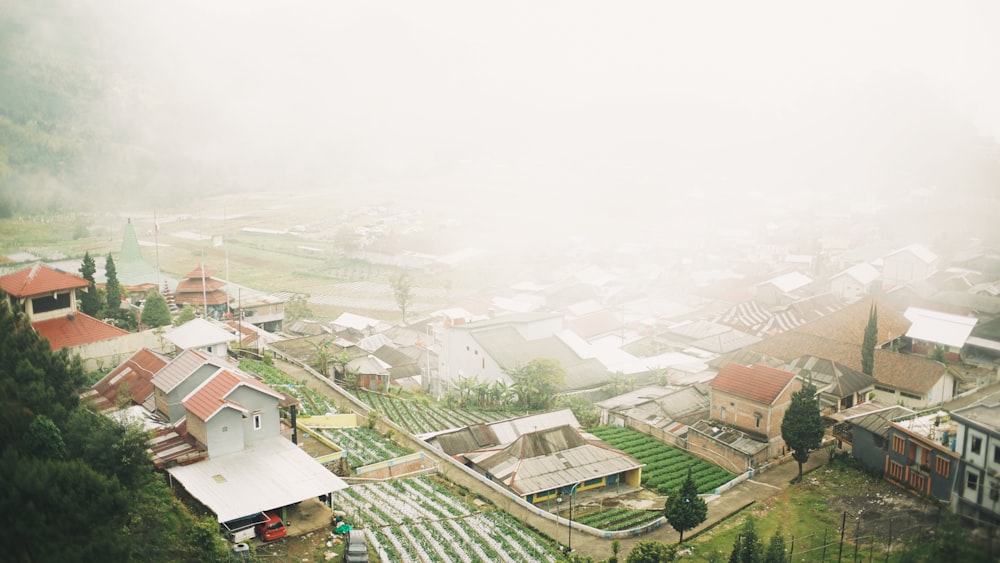 an aerial view of a village in the mountains