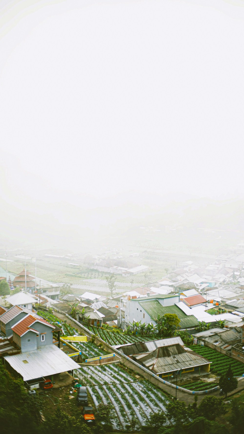 an aerial view of a town with a clock tower