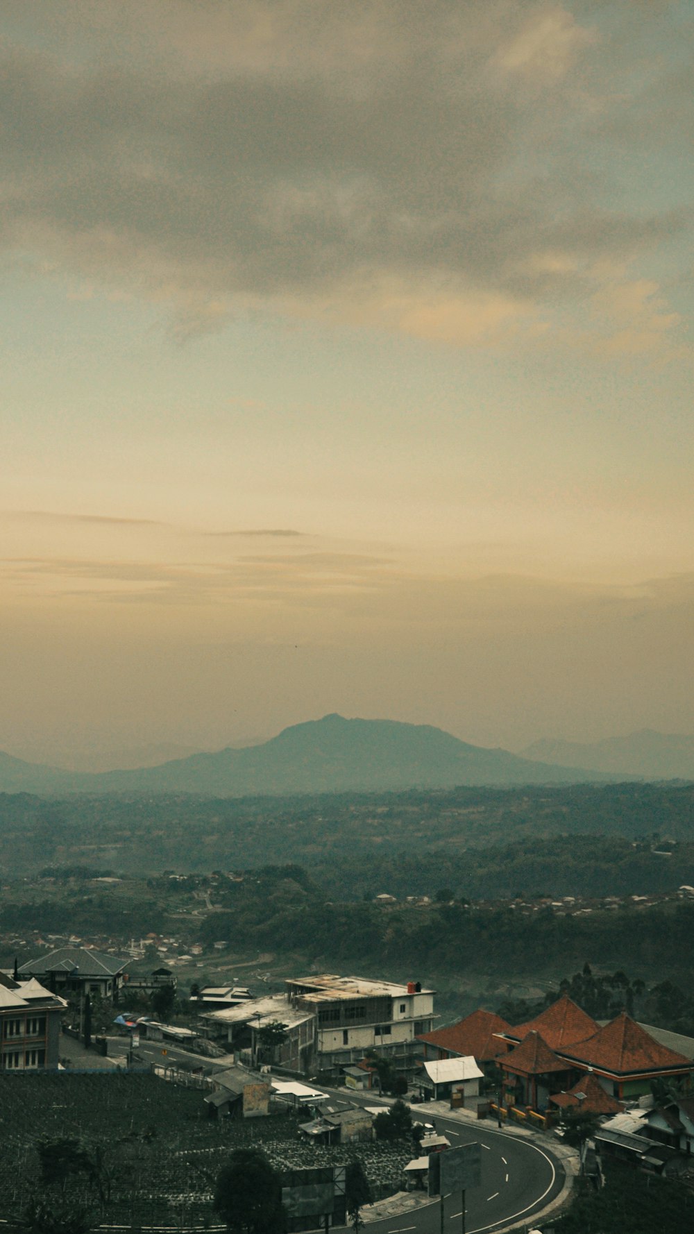 a view of a city with mountains in the background