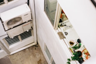 a white refrigerator freezer sitting inside of a kitchen