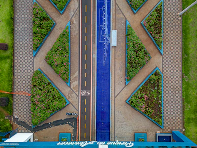An aerial view of an urban planning layout showing interconnected green spaces and pedestrian pathways.