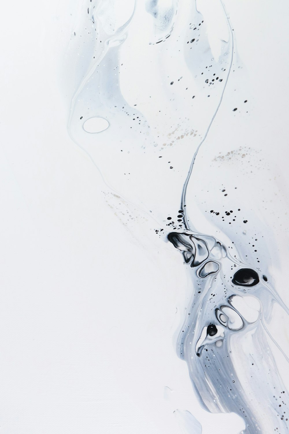 a white and black abstract painting with bubbles