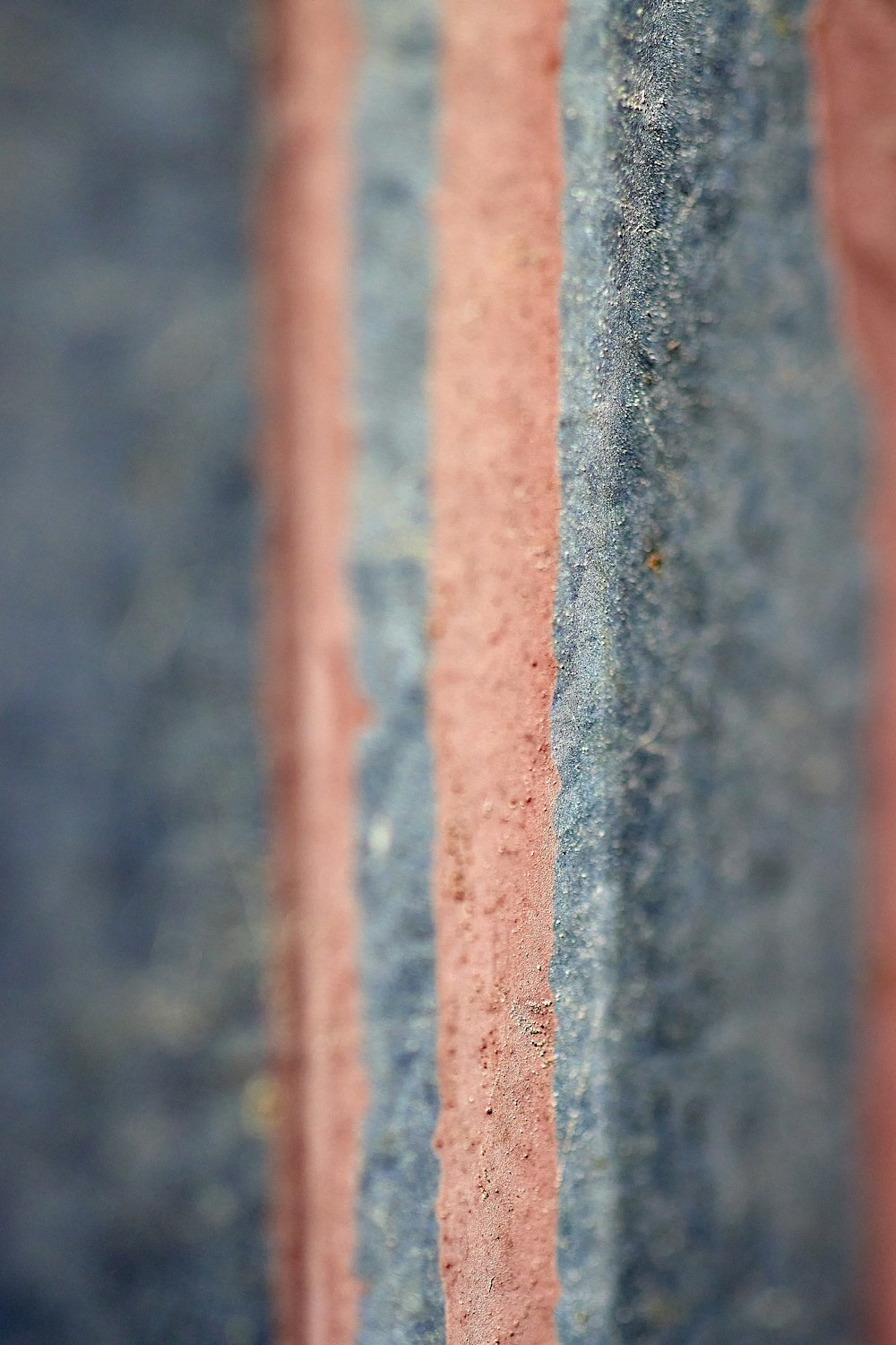 a close up of a red and blue striped wall