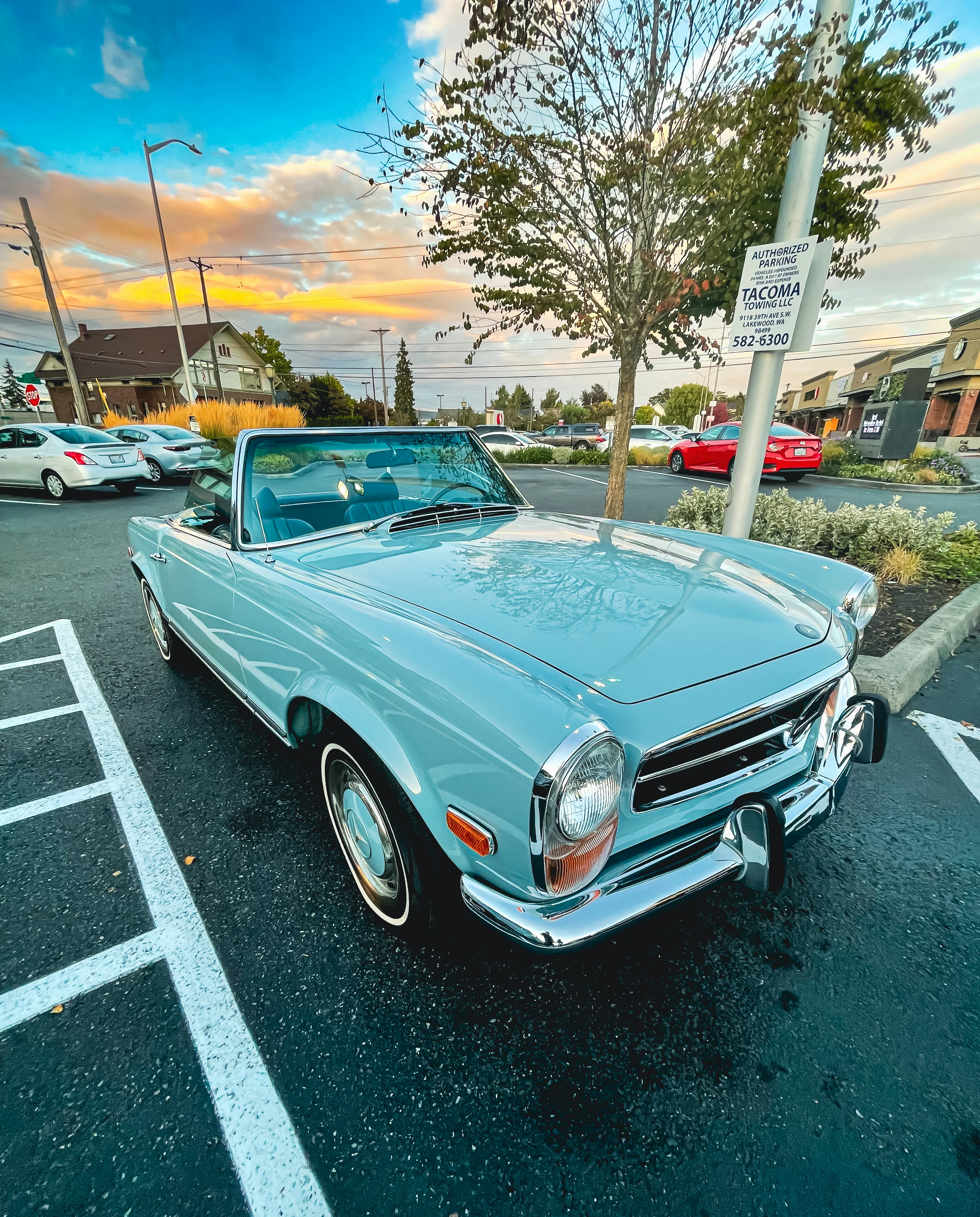 blue car parked in a parking lot