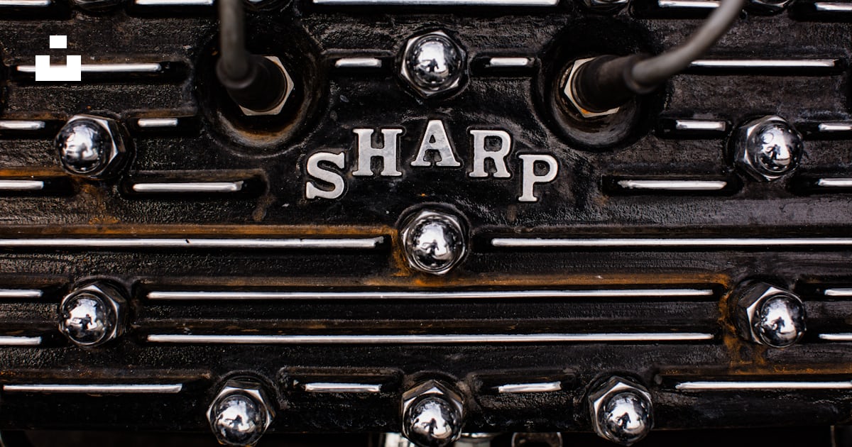 A close up of a metal object with the word sharp on it photo β Free ...