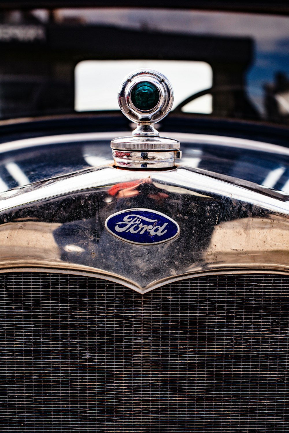 a close up of the front of an antique ford car