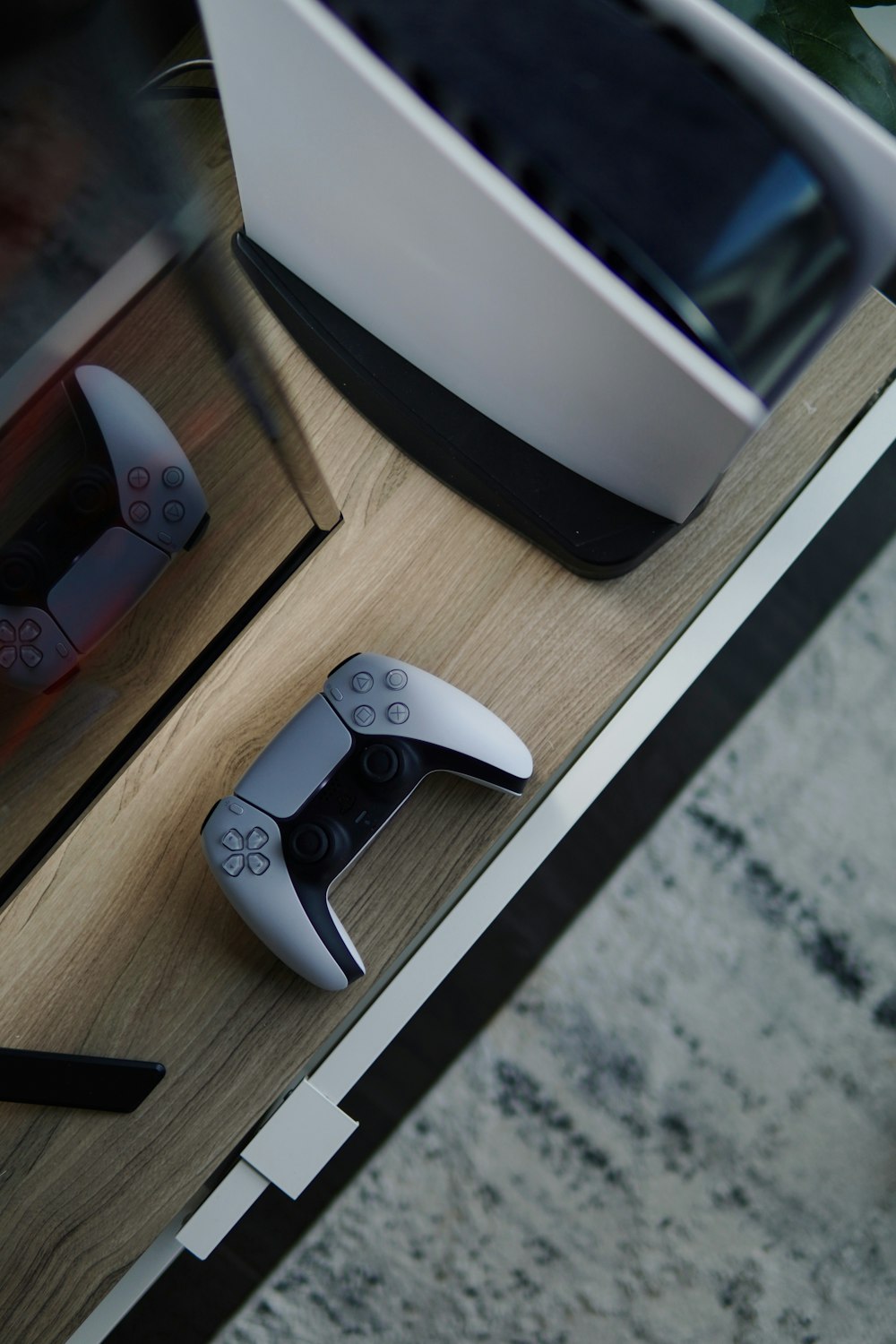 a remote control sitting on top of a wooden table