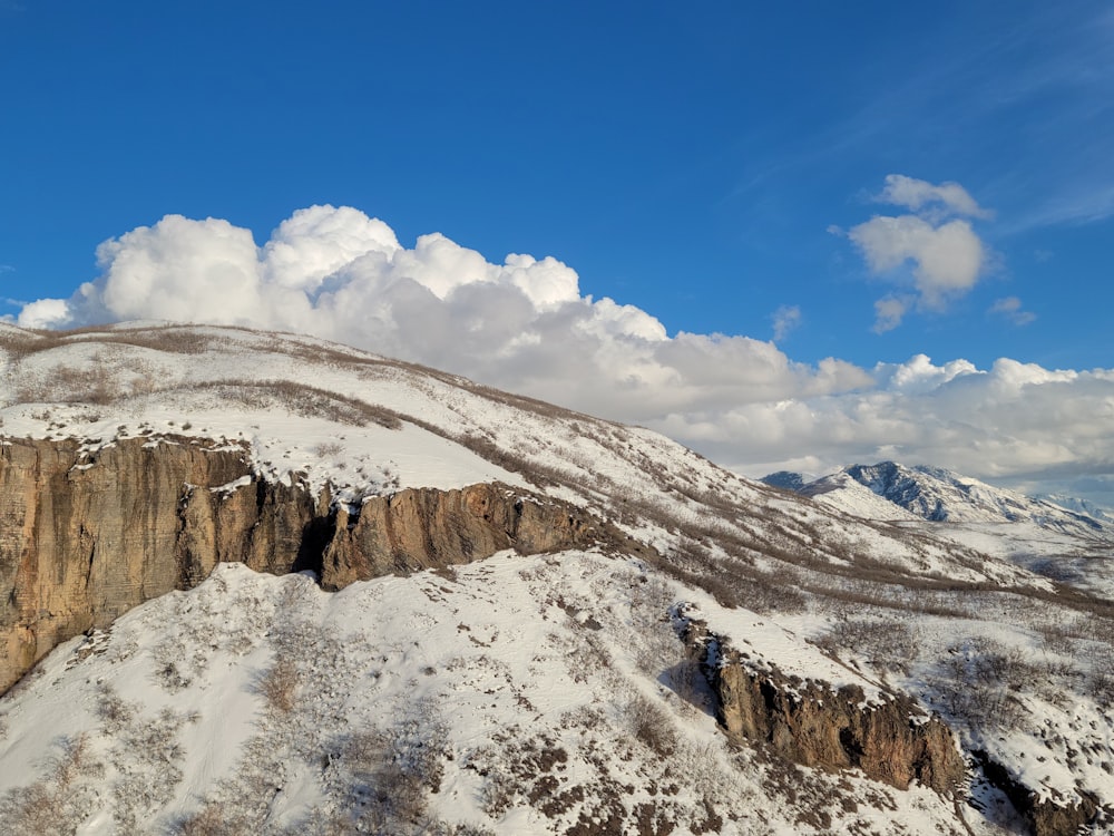 a snow covered mountain under a blue sky