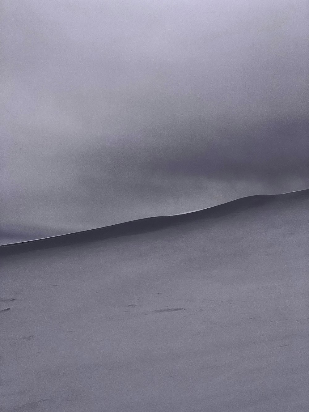 a person walking across a snow covered field