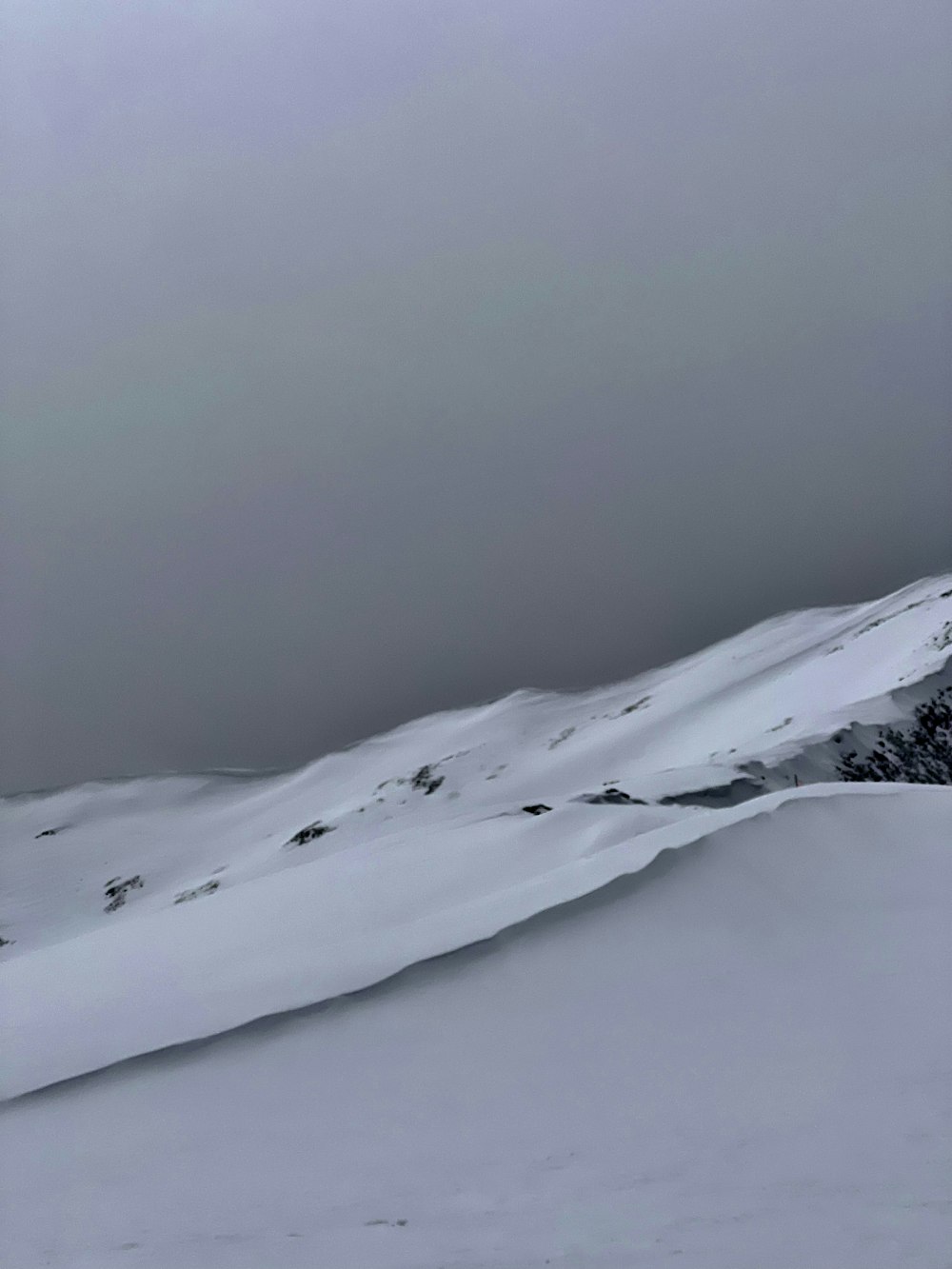 a person skiing down a snow covered mountain