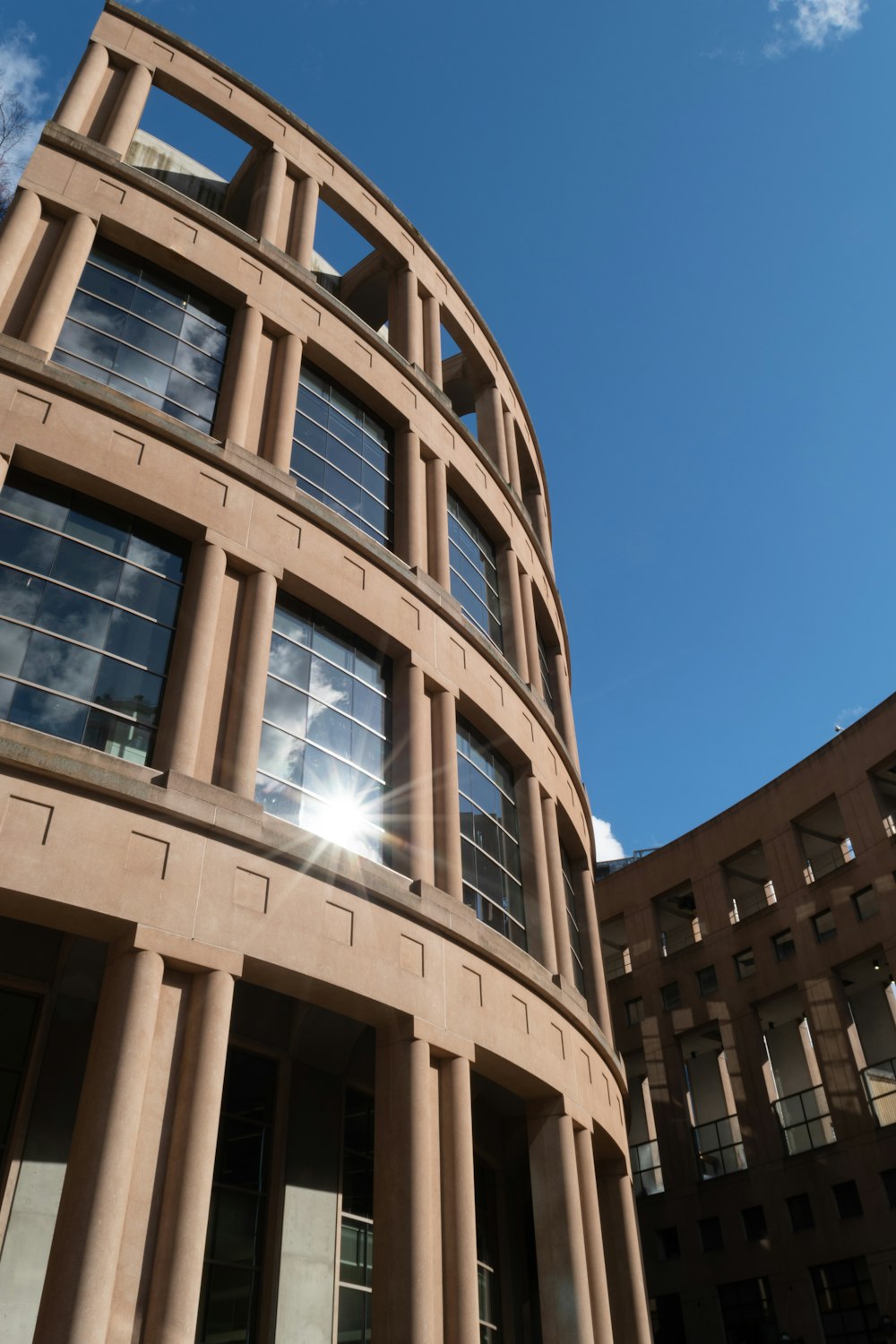 a tall building with a sky background