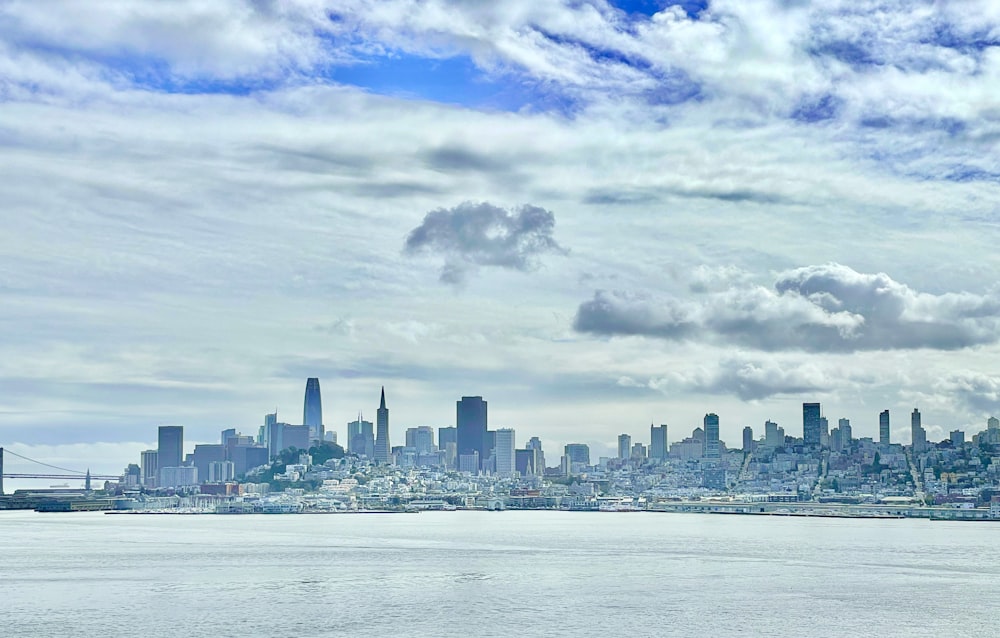 a large body of water with a city in the background