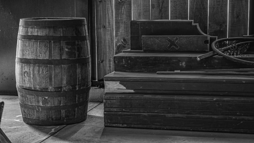 a black and white photo of a wooden barrel