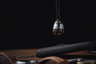 Close-up of a sleek, futuristic time capsule device glowing softly in a dark room