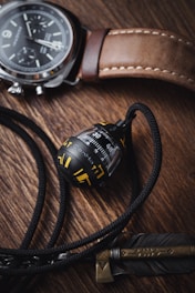 A sleek photo showing a watch, candle, and pet toy styled in inviting lifestyle settings.