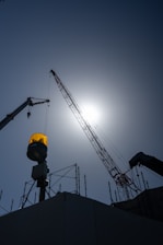 A simple construction site with a crane and caution signs symbolizing a website under development.