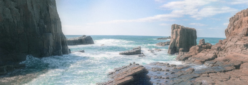 a view of a rocky coastline with a body of water