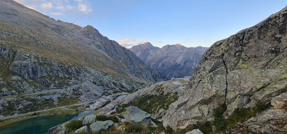 a view of a mountain range with a lake in the foreground