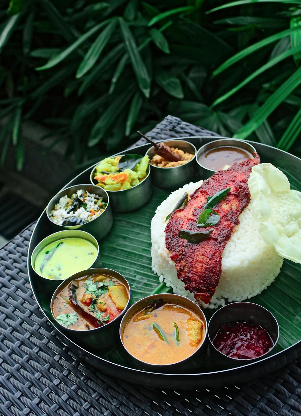 a plate of food on a table outside