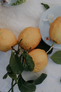 A colorful display of ripe lemons on a wooden table.