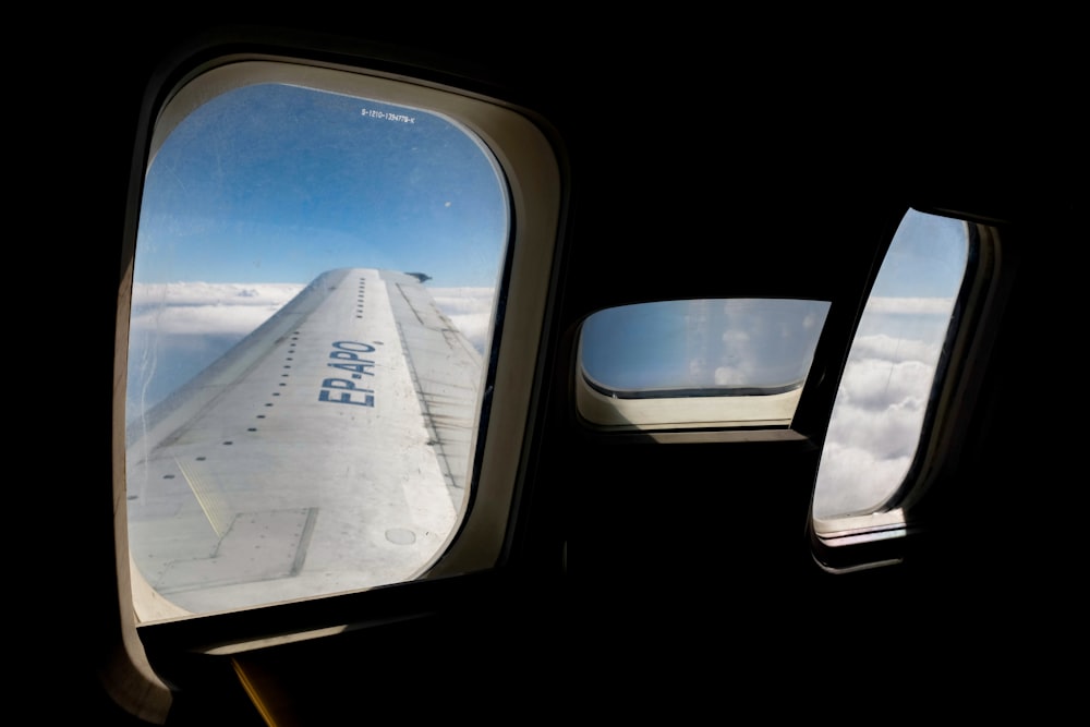 a view of the wing of an airplane through a window