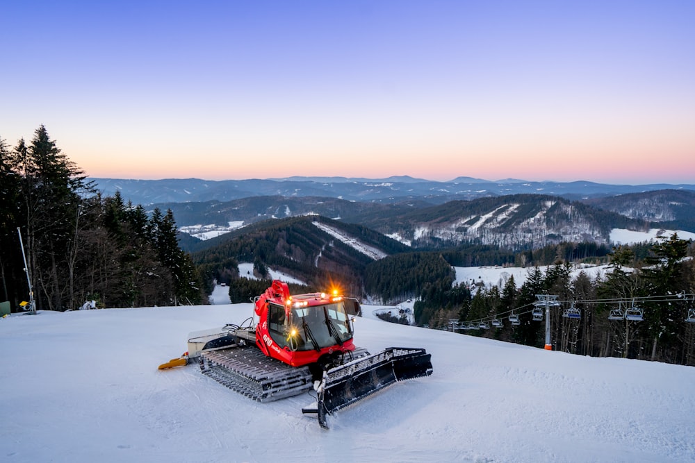 a ski lift sitting on top of a snow covered slope