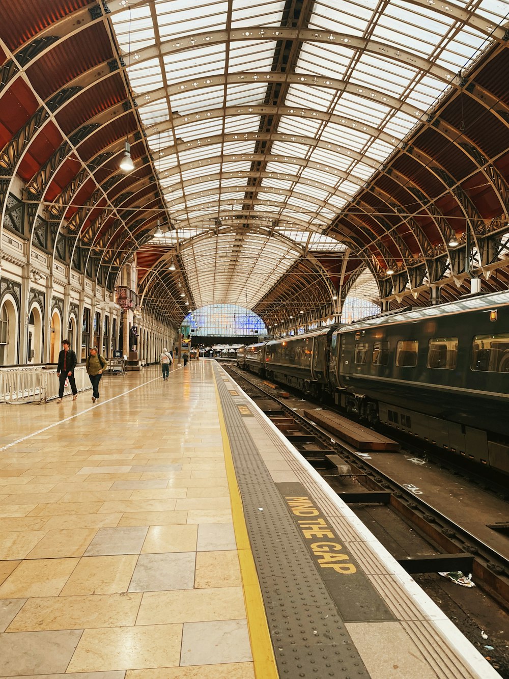 a train station with a train on the tracks