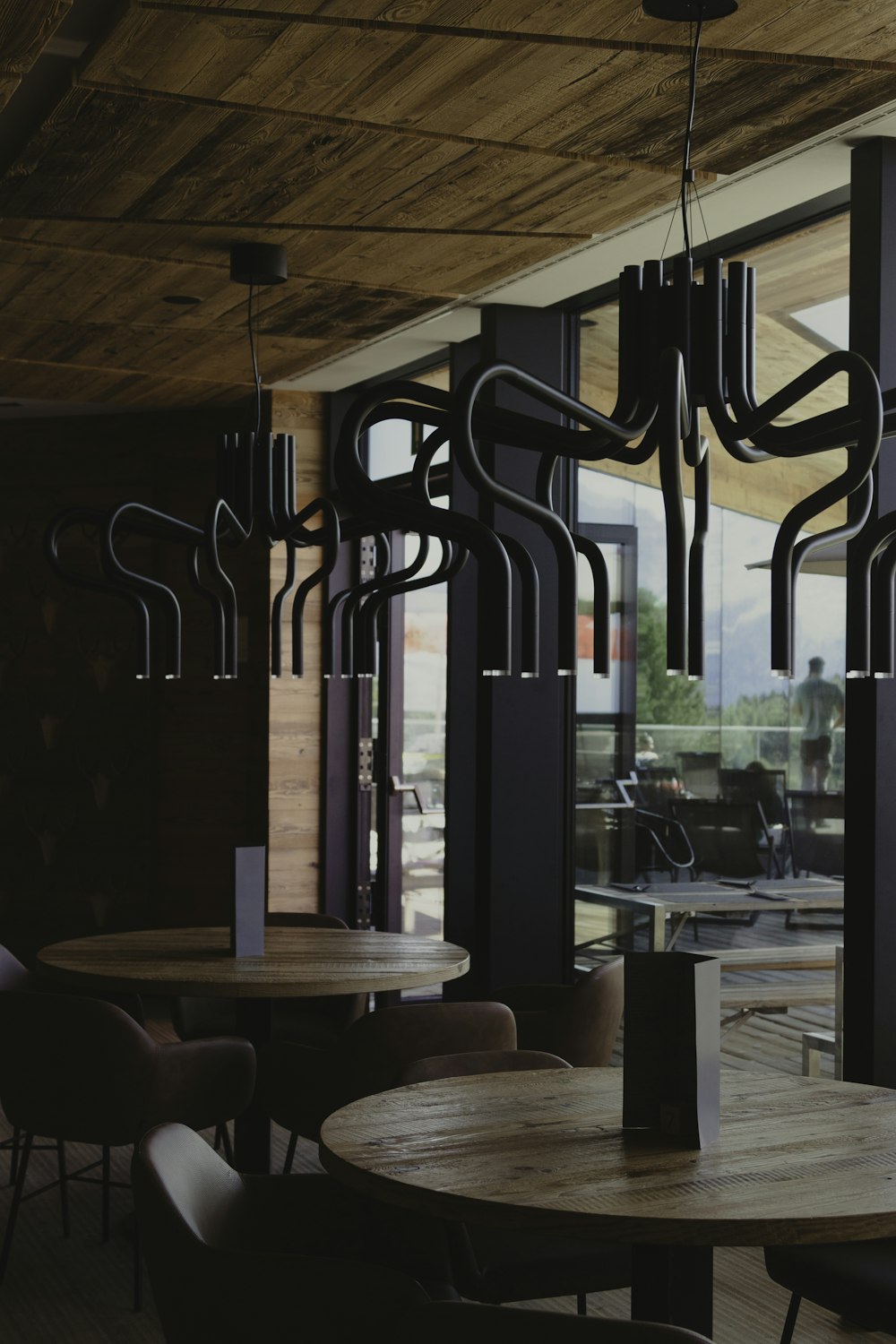 a dining room with a wooden table and chairs