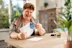 A smiling woman receiving IV therapy in a cozy home setting, looking relaxed and refreshed.