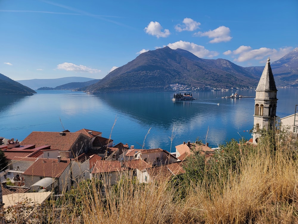 a scenic view of a town and a body of water