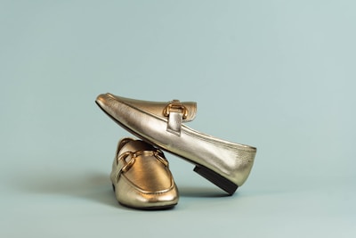 Casual loafers in various colors on a white background.