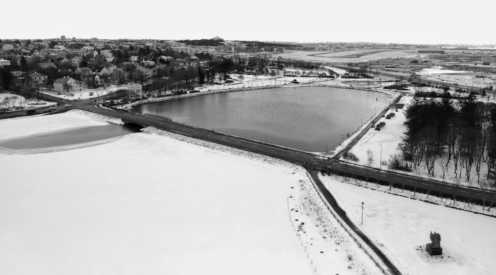 a black and white photo of a snow covered field