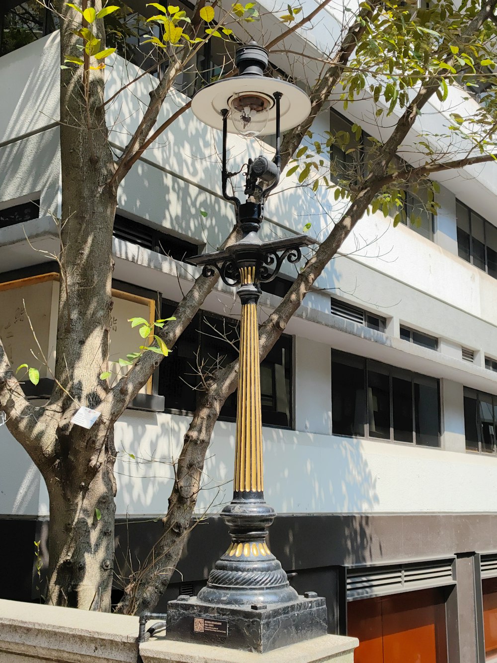 a lamp post in front of a building