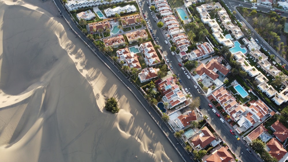 an aerial view of a city with sand dunes