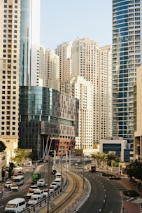 a city street filled with lots of tall buildings