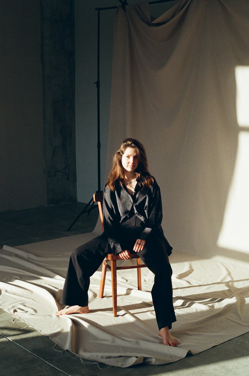 a woman sitting on a chair in a room