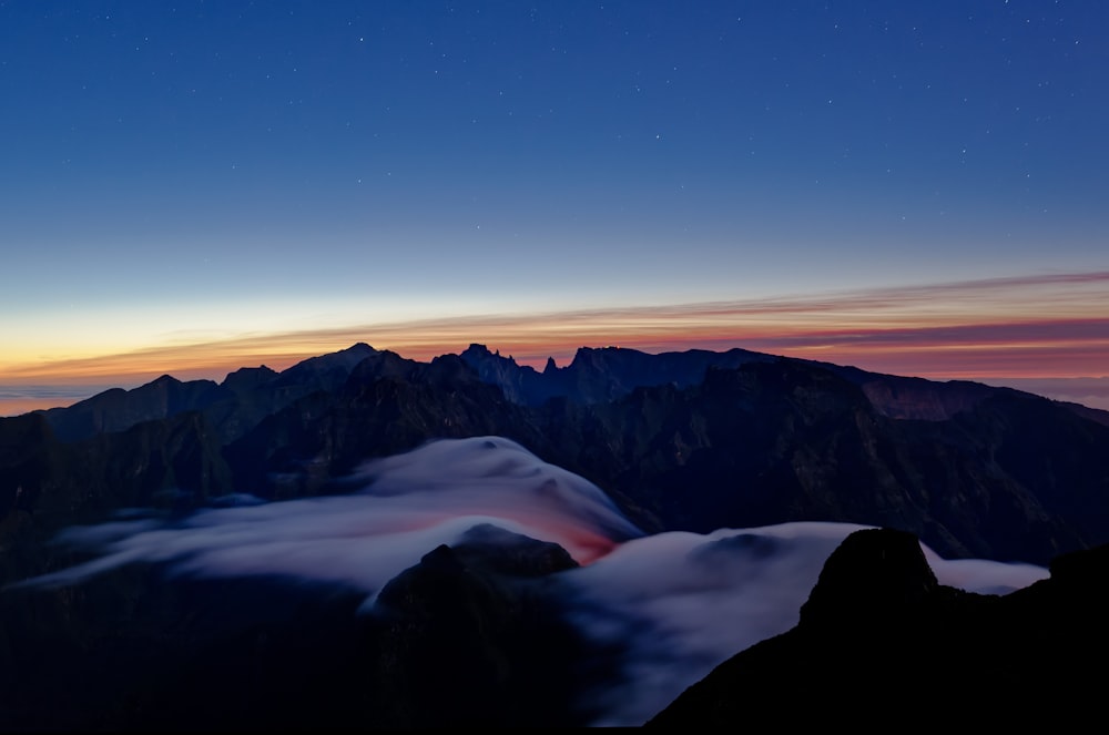 a view of a mountain range at night