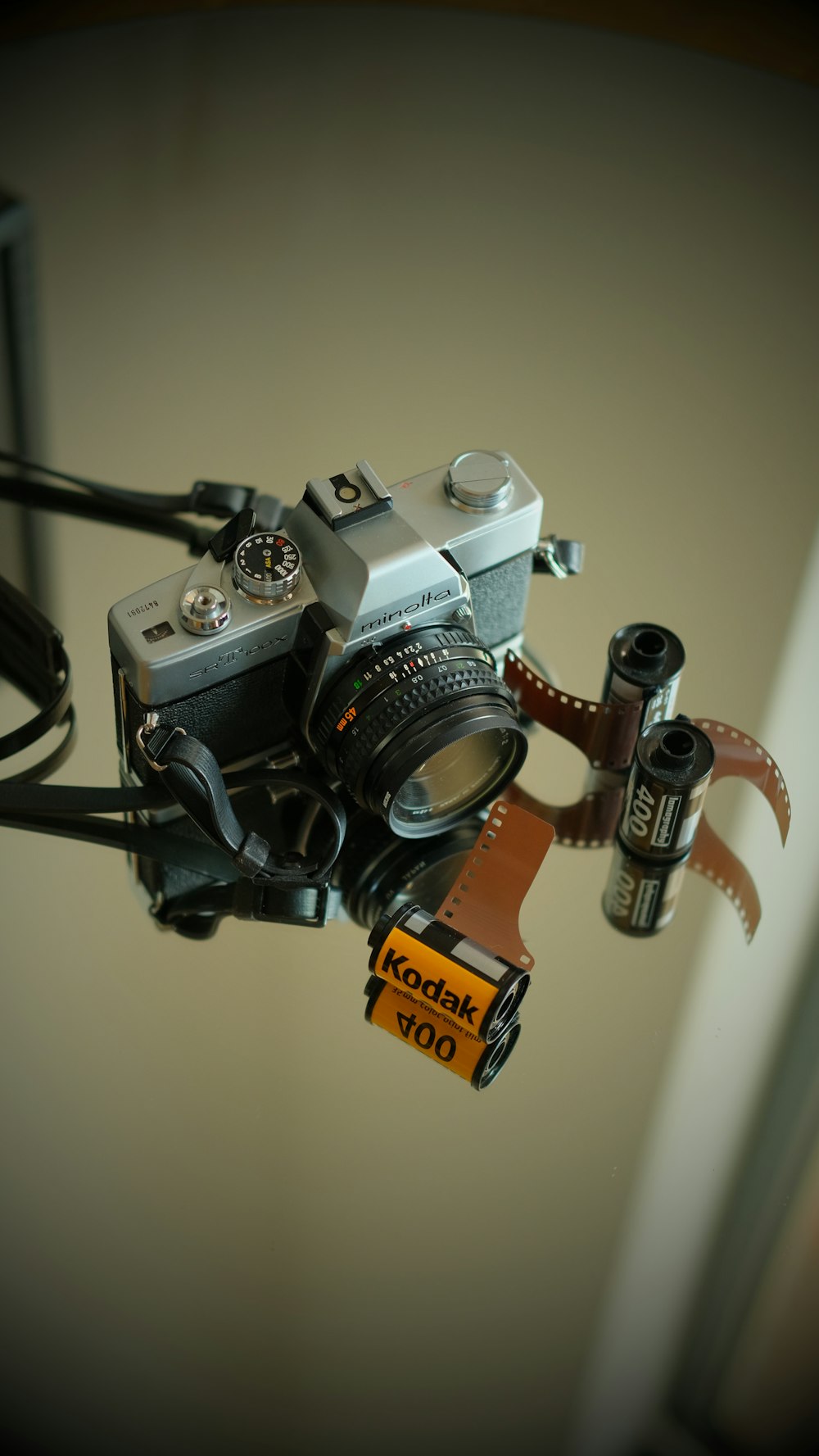 a camera attached to a tripod attached to a wall