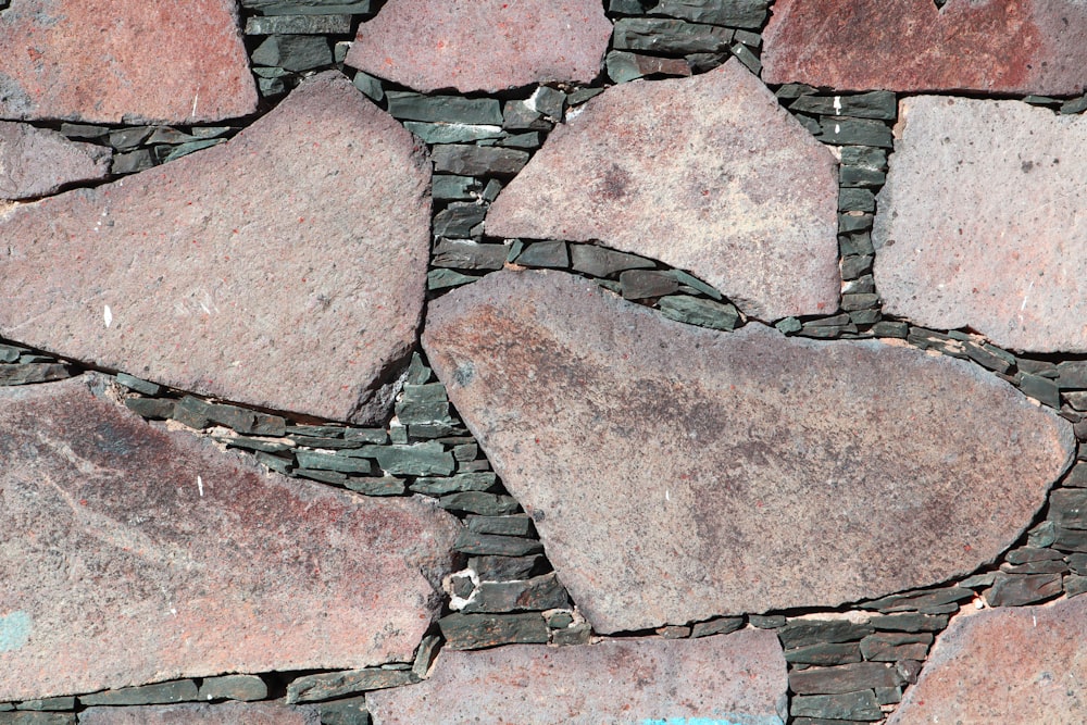 a close up of a stone wall made of rocks