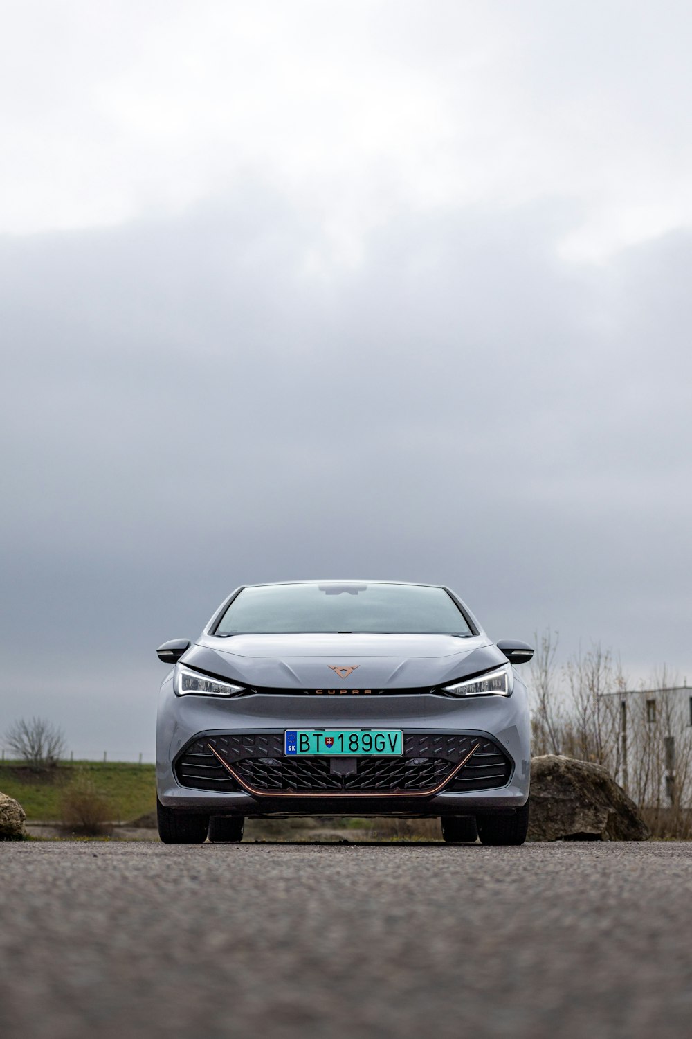 a silver car parked on the side of a road