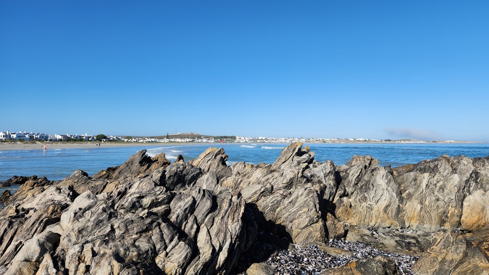 a view of the ocean from a rocky shore