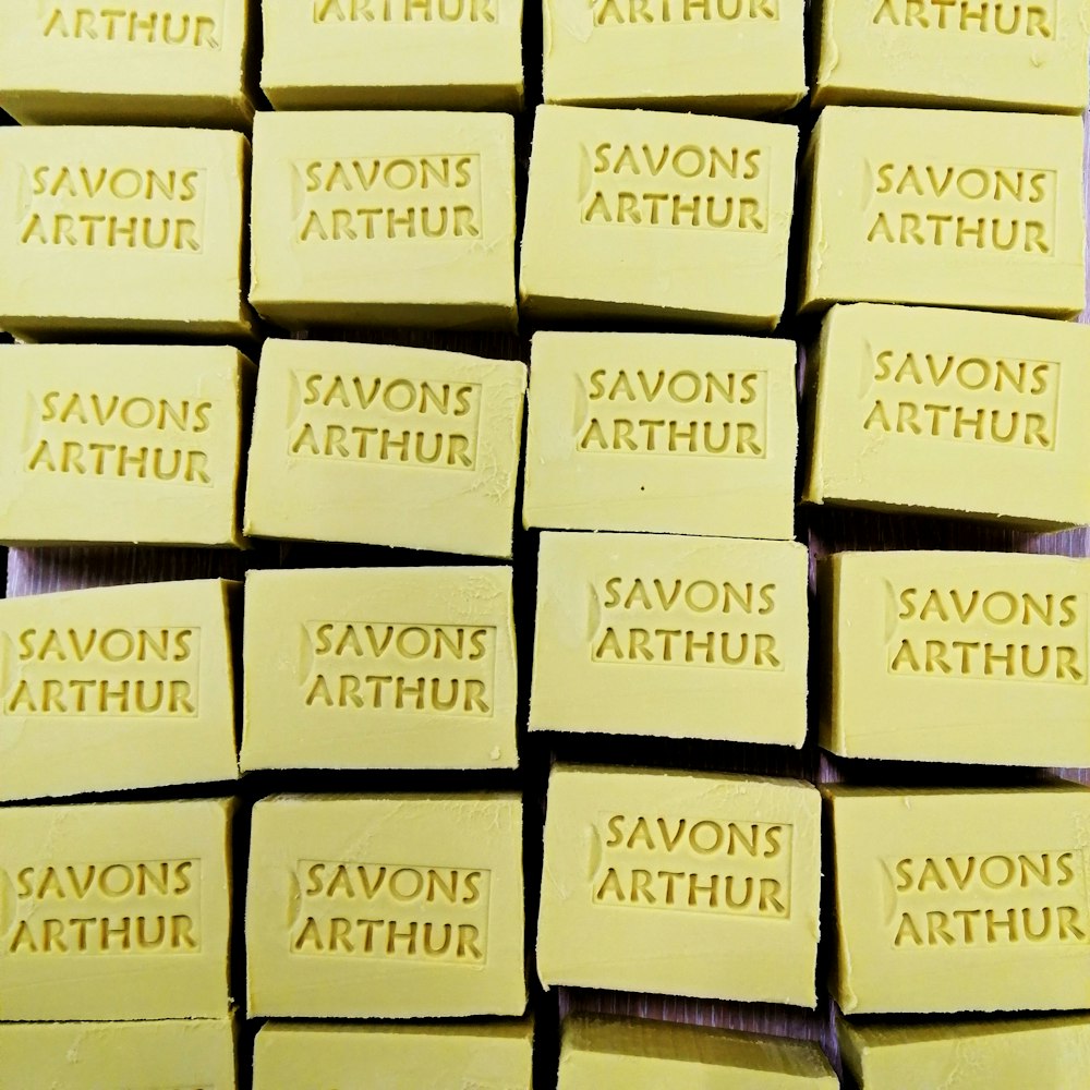 a pile of yellow soaps sitting on top of each other