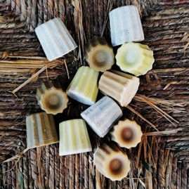 a group of soaps sitting on top of a wicker table