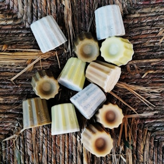 a group of soaps sitting on top of a wicker table