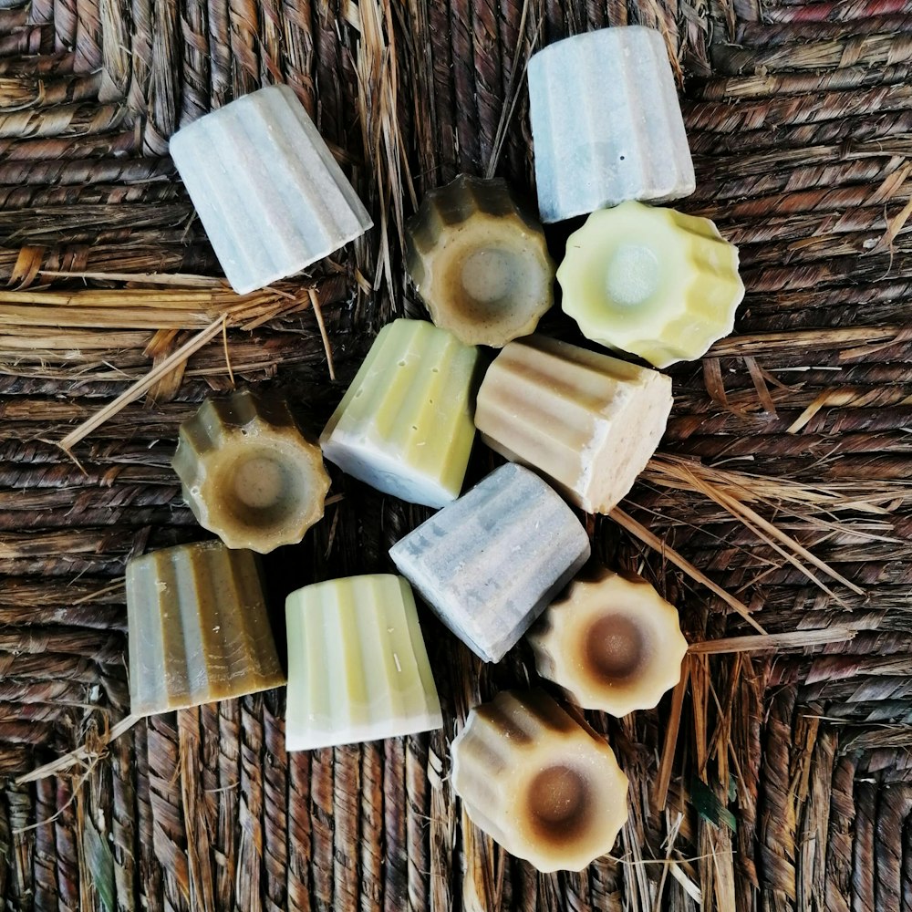 a group of soaps sitting on top of a wicker table