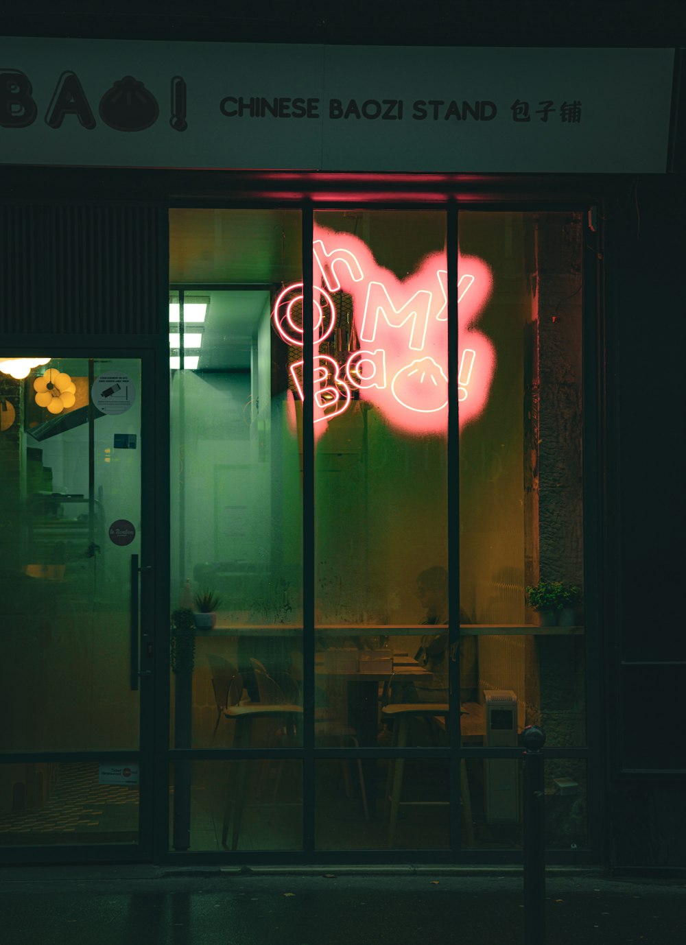 a neon sign in the window of a restaurant