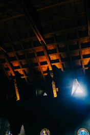 A vibrant point-cloud render of a historic church interior glowing softly in dark mode.