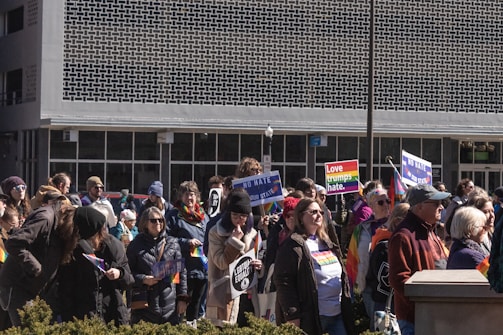 A diverse group of people gathered outdoors, symbolizing community unity.