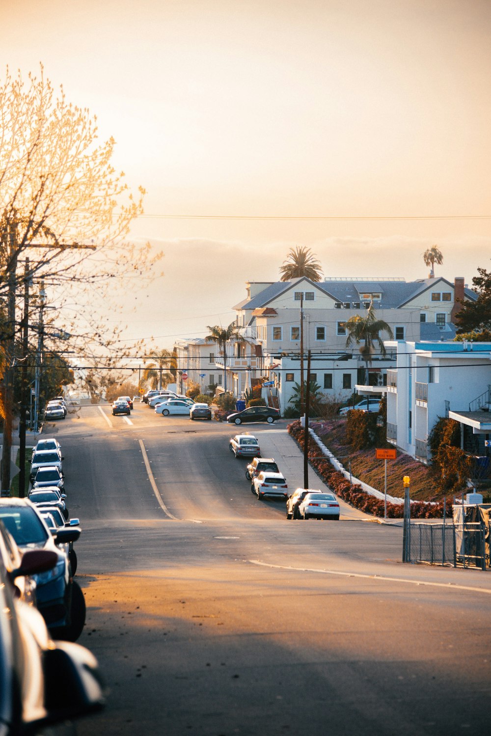 a street with cars parked on both sides of it