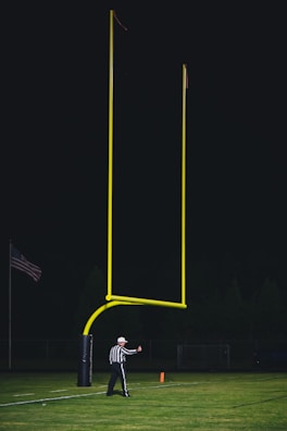 A referee showing a yellow card to a player.